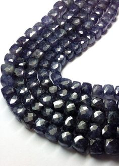 three strands of black and white glass beads