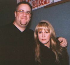 a man and woman standing next to each other