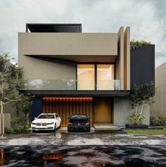 two cars parked in front of a modern house