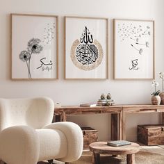 three framed pictures hang on the wall above a chair and table in a living room