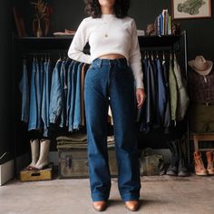 "Vintage 70s Levis Wide Leg Jeans Nice dark wash denim High waisted fit that hugs the top of the hips w/ a Wide straight leg Size measured flat: 27\"x32\" Model: 5'2\" wearing 2\" heel boots - Waist: 27\" (across top waistband) - Inseam: 32\" (crotch seam to bottom hem) - Rise: 11\" (crotch seam to top of waist) - Hips: 20\" (straight across below end of zipper) - Thigh: 10.5\" (crotch seam to outseam) - Knee: 9\" - Cuff: 9\" (lower leg opening) Please use listed measurements for sizing. Do not Dark Wash Straight Leg Jeans, Retro Straight Leg Fall Jeans, Retro Straight Leg Jeans For Fall, Vintage Mid-rise Jeans For Everyday, Vintage Straight Leg Jeans For Fall, Vintage Dark Wash Pants For Fall, Retro Dark Wash Relaxed Fit Flare Jeans, Dark Wash Retro Relaxed Fit Flare Jeans, Vintage Relaxed Fit Jeans For Fall