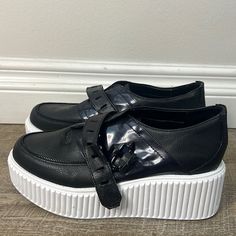 Please See There Is Wear On Shoes . Never Worn . Kept In Storage . Slip-on Platform Sneakers With Round Toe, Black Platform Sneakers With Round Toe, Slip-on Synthetic Platform Sneakers With Round Toe, Edgy Black Platform Sneakers With Lug Sole, Black Platform Sneakers For Streetwear, Black Sneakers With Lug Sole And Flat Heel, Black Pointed Toe Synthetic Sneakers, Black Platform Sneakers With Contrast Sole And Round Toe, Black Platform Sneakers With Contrast Sole