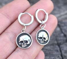 Skull Huggie Hoops details:-.925 solid sterling silver.-12mm huggie hoop approx. 1/2" diameter (latch back about 9mm through ear lobe), 2mm width/thickness.-Skull Measures 13mm round-Full dangle about 1.25"-Single or Pair availableConnect with us on Instagram @a_wild_violet for sales and giveaways!**All items are in stock and ship within 2-5 business days from received payment (excluding Saturday/Sunday) from the US. If you are within the US please expect 3-7 business days for shipping transit a Internally Threaded Dangle Hoop Earrings As Gift, Internally Threaded Hoop Earrings As A Gift, Adjustable Sterling Silver Huggie Earrings Gift, Internally Threaded Small Hoop Huggie Earrings For Gift, Small Hoop Internally Threaded Huggie Earrings For Gifts, Silver Gothic Hoop Earrings As Gift, Gothic Hypoallergenic Sterling Silver Jewelry, Gothic Sterling Silver Hypoallergenic Earrings, Gothic Small Hoop Silver Jewelry