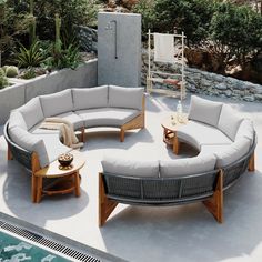 an outdoor living area with couches and tables