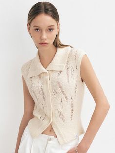 This product is a stylish knit vest that features a distressed design, adding a contemporary edge to a traditional piece. It includes a button-up front, which allows for versatility in styling as it can be worn open or closed. The vest is crafted with a soft, textured fabric that adds depth and interest to its overall appearance. - This vest is made from a unique blend of fibers that create a soft and comfortable feel against the skin.- The distressed detailing provides a modern, urban look, ideal for layering over shirts or dresses.- It features a series of functional buttons that can be fastened for a snug fit or left open for a more relaxed style.- The textured fabric not only enhances visual appeal but also contributes to the garment’s durability. Urban Looks, Modern Urban, Sweaters Knitwear, Knit Vest, Textured Fabric, Relaxed Style, Snug Fit, Layering, Overalls