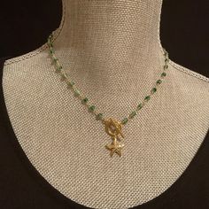 ❤️❤️  20% off and Free Shipping ❤️❤️ Beautiful emerald jade gemstone rosary chain with gold toggle clasp and pendant. Materials:  emerald, pearl, gold filled, cubic zirconia Made to order from 16-36". Please refer to photos and order 32" or above for the 2 strand look.  Chain has dainty natural 4mm emerald jade stones on non-tarnish gold plated chain. Toggle clasp is gold filled.  Your choice of 7 pendants: (1) Sand Dollar (2) pave Starfish (3) Fleur De Lis (4) Pearl (5) Pearl with Heart (6) Pav Adjustable Green Jewelry With Starfish Charm, Gold Necklaces With Star Charm And Round Beads, Gold Necklace With Star Charm And Round Beads, Handmade Green Star-shaped Jewelry, Green Star-shaped Handmade Jewelry, Star-shaped Jewelry With Beaded Chain For Gifts, Starfish Charm Necklace With Round Beads For Gifts, Green Necklace With Star Charm For Gift, Green Starfish Charm Jewelry As Gift