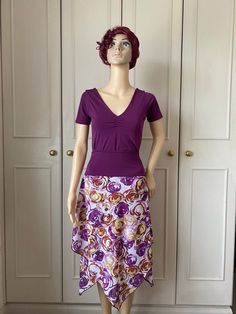 This skirt has a wide waistband in purple jersey. The skirt is non stretch and is made in an almost sheer light chiffon in abstract design in shades of purple, yellow and white. The skirt has two layers and is designed to vary in length. This falls loosely from the waistband and is free flowing. Great for dancewear. Matching top available Measurements  One available in small size only SOLD OUT Waist 58-78cm  Hips up to 100cm Length at longest point 77cm One available in medium size only  Waist 6 Fitted Flared Skirt Dress With Elastic Waistband, Fitted Dress With Elastic Waistband And Flared Skirt, Stretch Skirted Dress With Elastic Waistband, Stretch Dresses With Elastic Waistband And Skirted Shape, Stretch Dresses With Elastic Waistband, Stretch Purple Flared Skirt, Fitted Dresses With Elastic Waistband And Full Skirt, Purple Stretch Flared Skirt, Fitted Purple Maxi Skirt For Summer