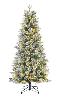 Christmas magic abounds with the shimmering frost berry slim Christmas tree. The 1247 branch tips are frosted for a sparkling overall effect. This tree will really twinkle with its 400 warm white/multicolor LED lights with 9 functions. It is not intended for outdoor use. This artificial tree was designed to last for years to come. 9 functions: 1) steady warm white, 2) steady multicolor, 3) fading between warm white and multicolor, 4) fading warm white, 5) fading multicolor, 6) flashing warm white, 7) flashing multicolor, 8) flashing between warm white and multicolor, 9) alternating between warm white and multicolor. Holiday Living 6.5-ft Slim Flocked Frost Berry Mixed Needle Pre-lit LED Artificial Christmas Tree | L21T11R2-65LD5K4 Berries Christmas Tree, Slim Christmas Tree, Artificial Christmas Trees, Artificial Tree, Artificial Christmas Tree, Christmas Magic, Flocking, Twinkle Twinkle, Warm White