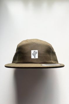 "The \"Cactus\" 5 Panel Camp hat is made in a low profile, classic fit with an adjustable clip closure. 100% cotton with woven label sewn on by our own hands in the USA. One size fits all, unisex fit. Imported. Please note: though I choose colors intentionally and precisely when creating my products, colors may slightly vary due to photographic lighting sources / image processing or your screen / monitor settings." Olive Hat, Old Nikes, Camp Hat, Profile Classic, Mountain Hat, Adventure Hat, White Cactus, Icon 5, Mountain Lover