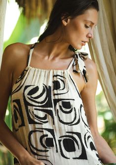 Meet the top-rated summer maxi dress of the season! This sleeveless stunner features a chic ivory and black bohemian print with a relaxed, flowy fit. The tiered hemline adds a playful touch, while the drawstring neckline with adjustable tie lets you customize the look. Perfect for the resort, brunch, beach days, and beyond! No matter where you take it, the Emerson maxi will be your go-to bohemian dress of the season! Bohemian print Relaxed, flowy fit Sleeveless Maxi length Tiered hemline Drawstr Black Bohemian, Maxi Dress Designs, Drawstring Neckline, Bohemian Maxi Dress, Bohemian Print, Beach Maxi Dress, Summer Maxi, Boho Beach, Beach Days