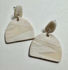 Simple two-toned, white geometric dangle earrings to go with every outfit Trendy Single White Earring, Trendy White Single Earring, Modern White Geometric Earrings, Trendy White Drop Earrings, Modern Single White Earring, Chic Single White Earring, Chic White Single Earring, Modern White Earrings With Ear Wire, Everyday Beige Dangle Earrings