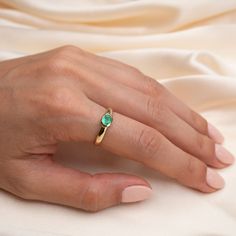 14k Gold Emerald Bezel Ring Our new stunning 14k Gold Emerald Bezeled Ring is beautiful ring that stands alone with its stunning green hues. Hand set by us, for you in a simple yet timeless 14k Bezel Ring. Featuring a 1/2 Carat Genuine Emerald forged in 14k Solid Gold Band Width: 5.25mm tapering down to 3.25mm at the shank Stone/Bezel Size: 6mm x 4mm Built to last a lifetime and more. Due to the handmade nature of this ring, please allow 1 - 3 weeks for processing. Heirloom Solitaire Emerald Ring, Opal Ring With Bezel Setting For Promise, Opal Ring With Bezel Setting And Round Band, 14k Gold Emerald Ring With Tension Setting, Yellow Gold Emerald Ring With Tension Setting As Gift, Emerald Ring With Bezel Setting, Oval Birthstone Ring With Tension Setting, Oval Emerald Ring With Tension Setting In Fine Jewelry, Elegant Opal Ring With Bezel Setting For Promise