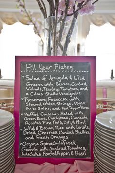 a table with plates and a menu on it