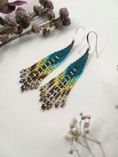 Pretty small, elegant earrings are made of the smallest Japanese seed beads, Czech beads and gold plated ear wires. Czech two-color beads (blue and brown) shimmer very interestingly. In general, this pair is full of play of shades and textures. Bohemian Long Drop Jewelry With Tiny Beads, Bohemian Teardrop Beaded Fringe Jewelry, Bohemian Teardrop Fringe Jewelry, Bead Fringe, Color Beads, Earrings Beaded, Beaded Fringe, Czech Beads, Feather Earrings