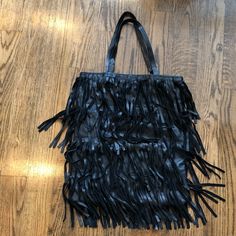 Is New But. It Has One Little Flaw, On One Of The Strap The Stitching Came Out Ant It Looks A Little Weird But Is Not Noticeable Unless Is Pointed Out, Other Than That Is In Excellent Condition Black Rectangular Bag With Fringe, Black Fringe Bag For Shopping, Trendy Black Shoulder Bag With Fringe, Black Fringe Shoulder Bag For Daily Use, Black Fringe Shoulder Bag For Shopping, Chic Black Bag With Fringe, Chic Black Fringe Bag, Black Fringe Bags, Leather Fringe Bag For Party