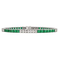 This sleek and elegant line bracelet from Tiffany & Co. features approximately 3.25 carats of emeralds accented by round white diamonds totaling approximately 1.80 carats. For over a century, the name Tiffany & Co. has been synonymous with beauty and luxury, qualities this bracelet possesses in abundance. Set in platinum. Marked "Tiffany & Co." on clasp 7 1/2" length Tiffany And Co Bracelet, Bracelet Tennis, Tiffany And Co, Emerald Diamond, Tennis Bracelet, White Diamonds, Tiffany & Co., Diamond White, Arm Band