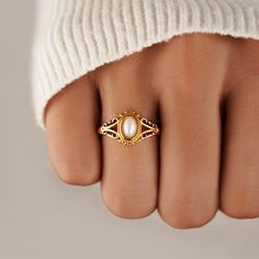 Our Vintage Royal Pearl Ring is a vintage-inspired dream come true. Crafted with stunning freshwater pearl, this beautiful piece is guaranteed to be a wardrobe essential for years to come. 18K gold-plated Stainless steel Natural freshwater pearl Hypoallergenic, lead & nickel free If you aren't in LOVE with your purchase, please let us know within 30 days of receiving your item, and you'll receive a stress-free refund. Royal Ring, Heirloom Ring, Pearl Wedding Ring, Pearl Rings Vintage, Vintage Gold Rings, Gold Pearl Ring, Jewelry Accessories Ideas, Jewelry Lookbook, Natural Pearl