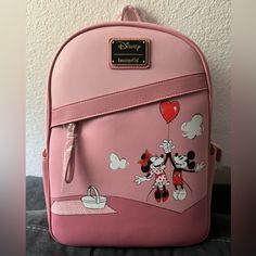 Nwt This Loungefly Disney Mickey And Minnie Valentine Balloon Mini Backpack Is A Must-Have For Any Disney Fan. The Backpack Features A Charming Design Of Mickey And Minnie Mouse Holding A Heart-Shaped Balloon And The Inside Is Pink With The Words Love In Red. The Backpack Is Made Of High-Quality Materials And Is Perfect For Everyday Use Or As A Collectible Item. Disney Style Backpack With Zipper Closure, Pink Backpack For Disney Trips With Zipper Closure, Disney Backpack With Zipper Closure For Daily Use, Daily Use Disney Backpack, Pink Backpack With Zipper Closure For Travel, Disney Minnie Mouse Backpack For Travel, Minnie Mouse Backpack For Disney Fan Events, Pink Bags With Zipper For Disney Trips, Pink Bags With Zipper Closure For Disney Trips