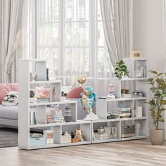 a living room filled with lots of furniture and bookshelves next to a window