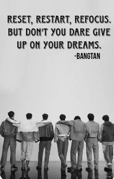 five men standing in front of a white wall with the quote rest, restart, repous, but don't you dare give up on your dreams