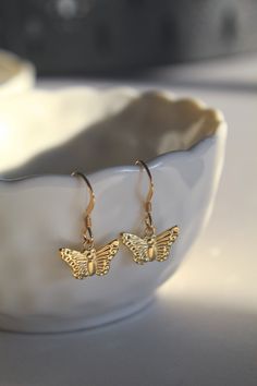 A stunning and lightweight design that effortlessly enhances your look! Whether its work or social, this pair will certainly compliment the occasion! Pair with our 14k Gold Butterfly Necklace.  - The Butterfly Charms are 9mm in diameter - Handmade and designed using 14k Gold Filled - Extremely comfortable and light weight. These Earrings will not weigh down your ears. - Will come beautifully packaged in a luxury padded jewellery box. All packaging is eco friendly. - Earrings, nose jewellery and Gold Minimalist Earrings With Butterfly Charm, Elegant Butterfly Earrings For Everyday, Minimalist Gold Earrings With Butterfly Charm, Elegant Butterfly Earrings For Everyday Wear, Delicate Gold Earrings With Butterfly Charm, Elegant Everyday Butterfly Earrings, Dainty Butterfly Nickel-free Earrings, Dainty Nickel-free Butterfly Earrings, Gold Earrings With Butterfly Charm For Everyday