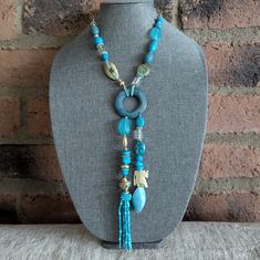 Details: Turquoise Color Elephant Charm Tassel Pendant Gold Tone Hardware Festival Necklace, Elephant Pendant Necklace, Chicos Jewelry, Crystal Heart Pendant, Beaded Pendant Necklace, Elephant Pendant, Elephant Charm, Beaded Statement Necklace, Charm Pendant Necklace