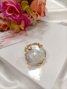 Adjustable brass ring with large baroque pearl. THE RING MAY APPEAR SLIGHTLY DIFFERENT THAN THE ONE IN THE PHOTO BECAUSE IT HAS BEEN REPRODUCED SEVERAL TIMES. Shipped in gift box Thank you Mary's laboratory Wedding Pearl Ring With Mother Of Pearl, Wedding Pearl Ring In Mother Of Pearl, Elegant Mother Of Pearl Ring For Gift, Elegant Mother Of Pearl Ring As Gift, Elegant Baroque Pearl Drop Ring, Gold Mother Of Pearl Ring As A Gift, Unique Pearl Ring Gift, Handmade Gold Pearl Open Ring, Baroque Pearl Drop Ring As Gift