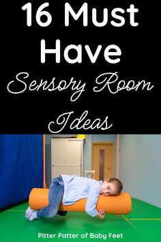 a baby laying on top of an orange roller in the middle of a room with text overlay reading 16 must have sensory room ideas