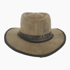 'The Buckthorn is well suited to the adventurous soul who craves a rugged hat for outdoor exploring. Made of waxed cotton that repels moisture, the Buckthorn is an outback safari style that features a vented modified teardrop crown for air flow. Trimmed with a faux leather hat band and matching brim edging, this sturdy hat will stay in place with its adjustable chin strap. Lightweight and pliable, the wide brim offer a hidden wire along the edge that can be hand shaped to meet your needs. *Exclu Rugged Fedora Hat For Outdoor, Rugged Brown Hat For Travel, Rugged Brown Travel Hat, Western Hats With Leather Patch For Outdoor, Western Outdoor Hat With Leather Patch, Western Style Hat With Leather Patch For Outdoor, Brown Rugged Outdoor Hat, Rugged Travel Hat With Curved Brim, Western Distressed Brown Hat For Outdoor