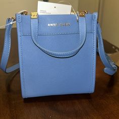 Anne Klein Elemental Blue Mini Bag Trendy Blue Square Box Bag, Blue Square Box Bag For Everyday Use, Blue Square Box Bag For Everyday, Everyday Blue Square Box Bag, Light Blue Double Handle Bag With Top Carry Handle, Light Blue Satchel Shoulder Bag With Top Handle, Light Blue Tote Bag With Detachable Handle, Blue Rectangular Box Bag For Everyday Use, Modern Blue Satchel Box Bag