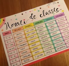 a spanish class timetable on a wooden table