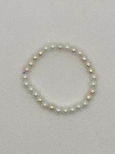 White Pearl Beaded Bracelet Regular size bracelet  Handmade with care in the UK Clay pearl beads  International shipping available ✨ *Returns and exchanges are not accepted. However if you have an issue with this product, then contact me and I'll try to resolve it. *Product may vary in colour due to photographic resources. Adjustable Pearl White Beaded Bracelets With Pearl Drop, Beaded Pearl White Round Bracelet, Pearl White Beaded Round Pearl Bracelet, Adjustable Crystal Bracelet With Pearl Charm, Adjustable Hypoallergenic Pearl White Pearl Bracelet, Classic White Beaded Stretch Bracelet, Pearl White Beaded Bracelets With Pearl Drop, Adjustable White Pearl Bracelets, Pearl Beaded Rosary Bracelet With Round Beads