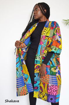 AMANI patchwork African print wide duster African inspired clothing African designer fashion African print kimono unisex clothing PRODUCT SPECIFICATIONS: All clothes are tailored and handmade with love and attention to details. Duster design - Wide and fancy Material - 100% cotton, African wax fabrics patchwork  SIZE CHART Sizes XXS to 3XL (please see detailed size chart in photos). Can be made-to-measure; please leave your measurements in the personalization box ADDITIONAL INFORMATION New and unworn: Yes Handmade in Kenya: Yes Multicolor Printed Outerwear With Kimono Sleeves, Multicolor Graphic Print Outerwear For Summer, Multicolor Graphic Print Summer Outerwear, Long Patchwork Summer Outerwear, Oversized Multicolor Patchwork Outerwear, Summer Long Patchwork Outerwear, Patterned Kimono With Vibrant Print, Beach Outerwear With Kimono Sleeves In Multicolor, Multicolor Long Printed Kimono