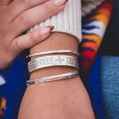 Like a fingerprint, each stamp in this collection is unique and embodies the stories and culture of the artist who created it. Each sterling silver bracelet in the Stamp Dancer Collection is hand stamped and handcrafted by our diverse collective of artisans under the T.Skies roof in Albuquerque, NM. The Sagebrush Stacker and Sage Twist were designed by Mathew James, founder of T.Skies. Sterling Silver Stacking Bracelet Set Handcrafted in New Mexico, USA Original Design by T.Skies Stackable Sterling Silver Bangle In White Gold, Stackable Sterling Silver White Gold Bangle, Stackable White Gold Sterling Silver Bangle, Gift Stackable Sterling Silver Bracelet In White Gold, Stackable White Gold Sterling Silver Bracelet As Gift, Adjustable White Gold Stackable Bracelets, Adjustable Stackable White Gold Bracelets, Stackable Sterling Silver Bangle Bracelets, Sterling Silver Stackable Bangle Bracelets