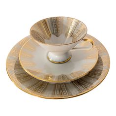 an empty cup and saucer sitting on top of each other