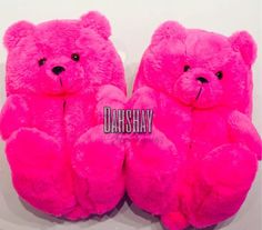 two pink teddy bears sitting next to each other on a white surface with the words darshay written below them