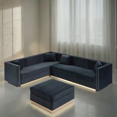 a living room with a blue couch and ottoman