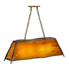 a light fixture hanging from a chain with a yellow glass shade on the top and bottom