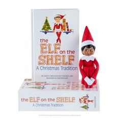 the elf on the shelf is next to two books