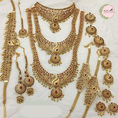 Premium Matt Finish Gold Plated South Indian Bridal Necklace Set With Maangtikka, Hair jewels, Waist Belt, Armlet | Women Party Wear Jewelry Item Includes   3 NECKLACE SET 1 MAANGTIKKA 1 PAIR EARRING 1 WAIST BELT 2 ARMLET 9 HAIR PINs Description Introducing our exquisite Premium Matt Finish Gold Plated South Indian Bridal Necklace Set with Maangtikka, Hair Jewels, Waist Belt, Armlet. This meticulously crafted jewelry ensemble is designed for women who want to make a statement at weddings, parties, and other special occasions. This stunning set includes three captivating necklace pieces, each showcasing intricate patterns and delicate embellishments. The layered effect created by these necklaces adds a touch of opulence and elegance to your attire, highlighting your unique style. Enhancing Indian Bridal Necklace, Unique Wedding Jewelry, Dazzling Earrings, Hair Jewels, Bridal Necklace Set, South Indian Jewelry, Bridal Jewellery Indian, Women Party, Pin Jewelry