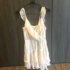 Nwt. Size Medium. Daytime Sleeveless Mini Dress With Lace Trim, Cream Sleeveless Sundress For Brunch, Off White Sleeveless Mini Dress With Ruffles, Off White Sleeveless Ruffled Mini Dress, Beige Sleeveless Mini Dress For Daytime, Sleeveless Beige Mini Dress For Daytime, Sleeveless Sundress With Lace Trim For Daytime, Off White Sleeveless Mini Dress For Day Out, Cream Sleeveless Mini Dress With Lace Trim