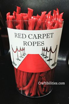 red carpet ropes are in a bucket on the table