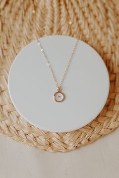 "Dainty, minimalistic, gold filled necklace that represents so much more. Encased in a small gold filled bezel is a REAL mustard seed. Serving as a meaningful reminder to have faith in Christ. Each necklace is packaged in a white box and comes with a keepsake card. Minimal in design, but packed full of meaning. Perfect for every day wear. Featuring a 16\" chain. These necklaces are 14k gold filled, which means they are NOT plated. They will not change colors on you or turn your skin green like p Everyday Tiny Charm Necklaces In 14k Gold Filled, Everyday Tiny Charm Necklace In 14k Gold Filled, Dainty 14k Gold Filled Initial Necklace For Everyday, Minimalist Everyday Initial Necklace With Birthstone, Minimalist Yellow Gold Birthstone Necklace With Delicate Chain, Minimalist 14k Gold Filled Charm Necklaces For Everyday, Everyday Minimalist 14k Gold Filled Charm Necklaces, Dainty 14k Gold Filled Birthstone Necklace For Everyday, Delicate 14k Gold Filled Birthstone Necklace For Everyday