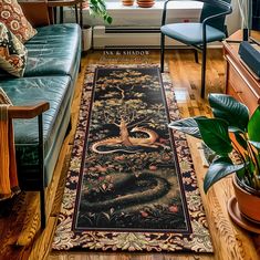 a living room filled with furniture and a rug on top of a hard wood floor