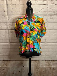 Colourful fun 1990's lightweight button up top. Womens medium  Shoulder to shoulder 15" Armpit to armpit 17.5" Length 21" Casual Button-up Top With Vibrant Print, Retro Summer Shirt With Colorful Pattern, Retro Shirt With Colorful Pattern For Summer, Multicolor Retro Print Button-up Top, Multicolor Buttoned Tops For Summer, Colorful Graphic Print Blouse For Summer, Retro Shirt With Vibrant Spring Print, Beach Button-up Top With Multicolor Print, Multicolor Collared Hawaiian Shirt For Spring