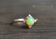 14/18K Aurora Opal Ring Gold Ethiopian Fire by MichelliaDesigns Mystical Yellow Gold Wedding Ring, Celestial 14k Gold Opal Wedding Ring, Mystical Halo Jewelry For Weddings, Celestial Style Opal Ring With Halo For Anniversary, Celestial Opal Ring With Halo For Anniversary, Celestial Halo Opal Ring For Anniversary, Celestial Halo Design Wedding Jewelry, Celestial Halo Jewelry For Wedding, Celestial Halo Wedding Jewelry