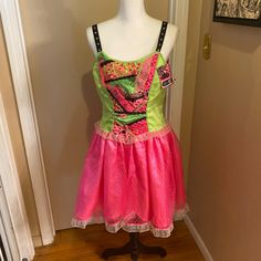 a pink and green dress on a mannequin