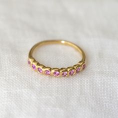 Pink Sapphires set in 18k yellow gold -- the stones has a pink hue with so much personality. Perfect for stacking or an unconventional wedding band 9 Stone Ring, Unconventional Wedding, Pink Sapphire Ring, Montana Sapphire, Pink Ring, Fine Rings, Blue Hues, Stone Ring, Pink Sapphire