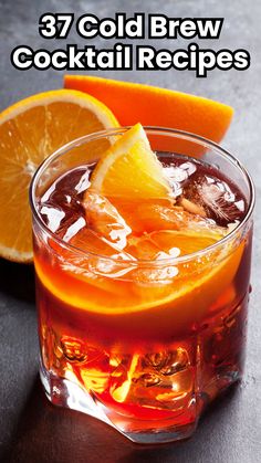 an orange drink in a glass with ice and lemon wedges