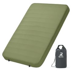 an inflatable sleeping pad with water bottle next to it